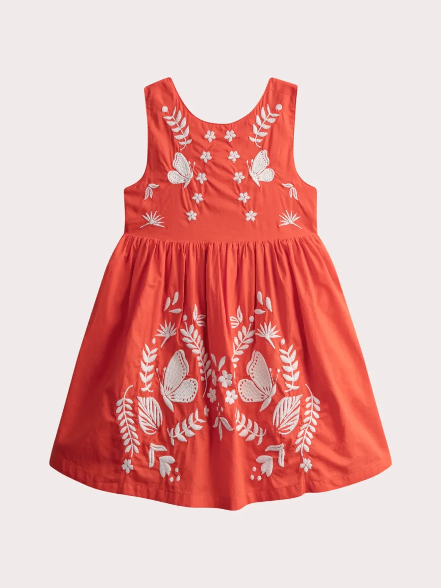 Robe orangée brodée croisée dans le dos